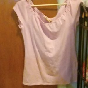 I am selling a light pink t shirt. It is a size large (11-13).